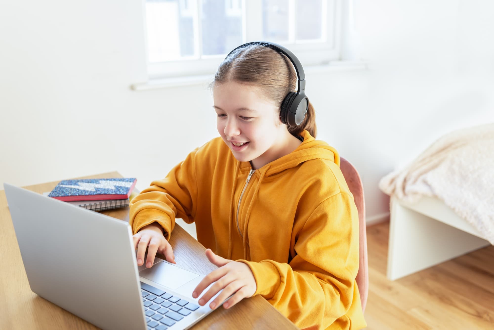 School-age girl learning from home