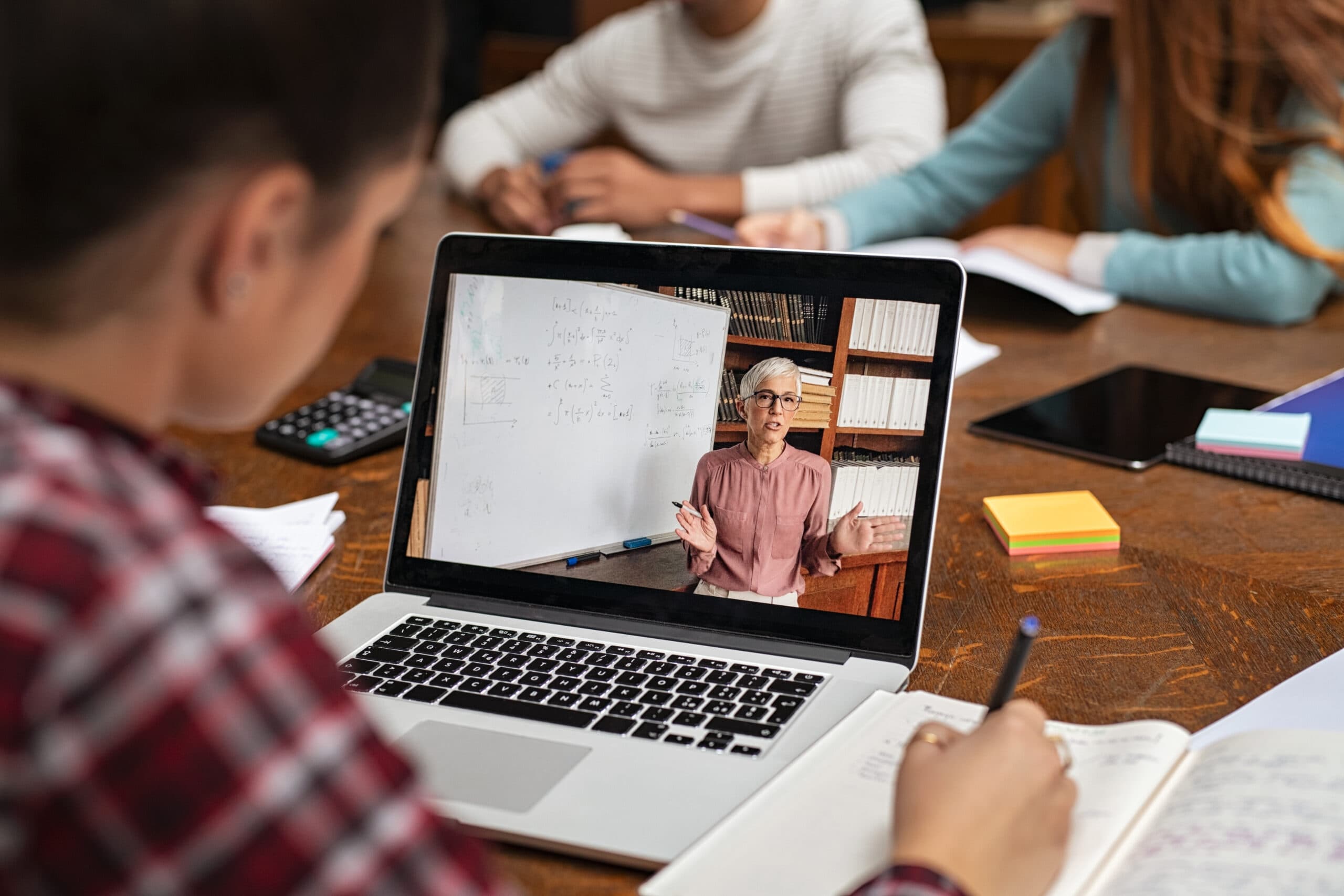 Student watching an online lesson at home