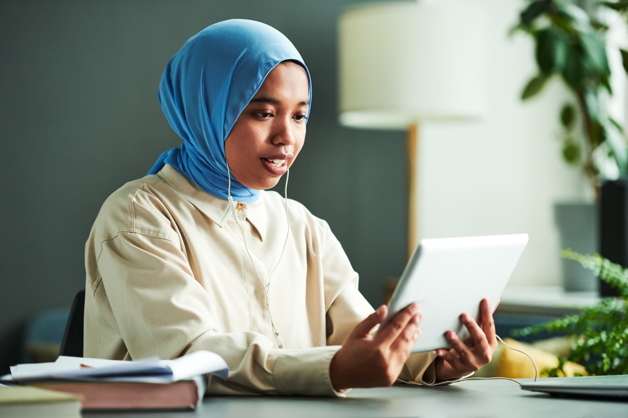 Confident teacher in a blue hijab
