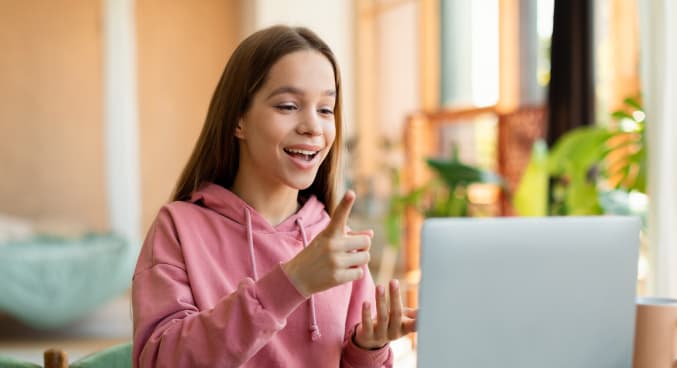 Teenager in a video conference with her teacher
